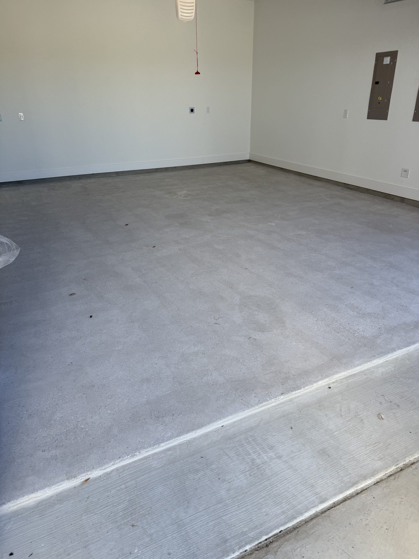 Concrete slab ground clean to the wall line before epoxy