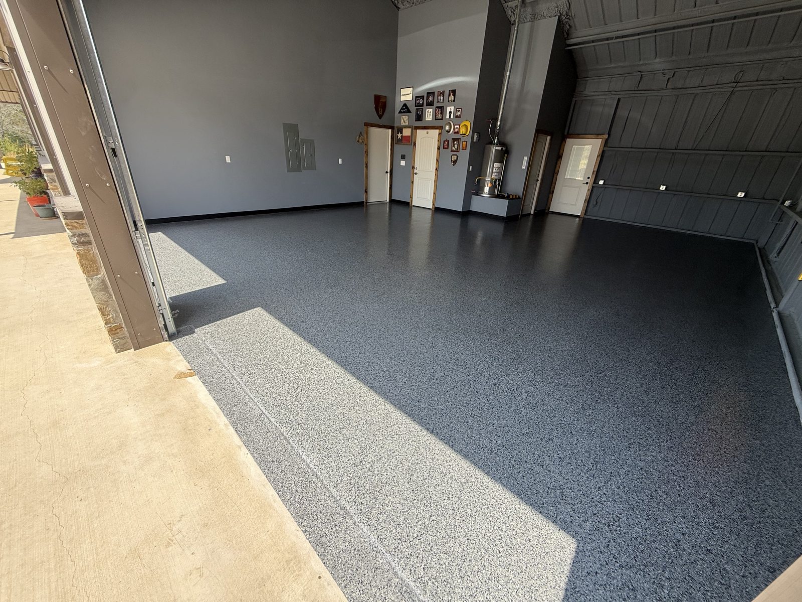Epoxy floor coated clean out to the overhead door threshold, Dodd City TX barndominium